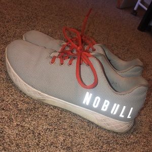 NoBull light gray shoes with red laces
